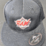 A black hat with the word " raw " on it.