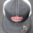 A black and white hat with the word " raw " on it.