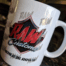 A coffee mug with the word raw written on it.