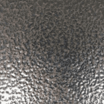 A close up of the surface of a metal sheet
